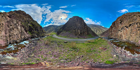 Full Spherical panorama of a mountain ravine with dirt road and river turn at springtime day in...