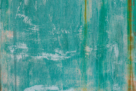 Weathered sun-bleached turquoise metal wall with rust outdoors - full-frame texture and background.