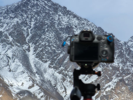 Camera filming snow-covered mountain range during daytimeの写真素材