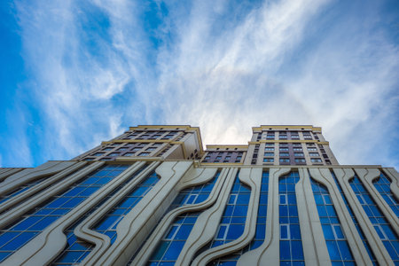 Modern high-rise apartment building in serene city settingの写真素材