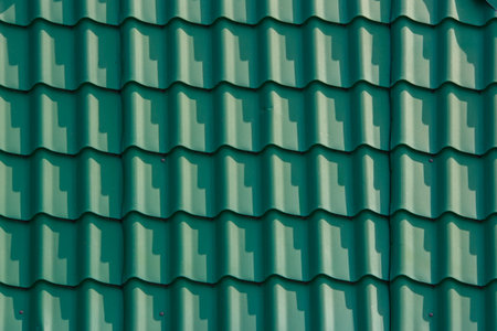 Close-up view of textured green roof corrugated painted green steel sheetsの写真素材