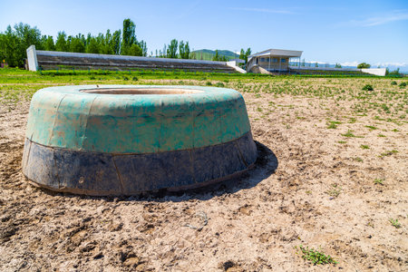 Green kazan in Kok-Boru stadium at sunny summer day.の写真素材