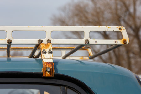 Rusty aluminum car roof rack attached to vehicle in natureの写真素材