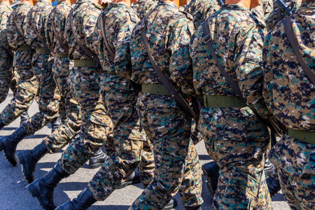 Soldiers marching in camouflage uniforms at military paradeの写真素材