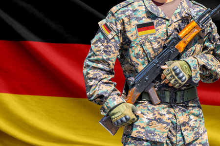 Germany flag with soldier holding assault rifleの写真素材
