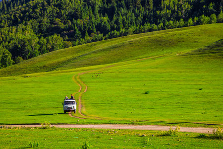 Semenovskoye Gorge, Issyk-Kul Region, Kyrgyzstan July 17, 2024 - Tourists on Vintage UAZ Van driving...