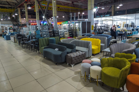 Bishkek, Kyrgyzstan - June 7, 2024: Upholstered sofas and armchairs display inside Taatan furniture hall at Alamedin market Bishkekのeditorial素材