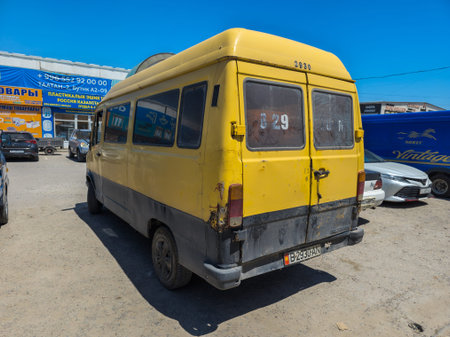Bishkek, Kyrgyzstan - June 7, 2024: Old yellow minivan parked at Alamedin market Bishkek Kyrgyzstanのeditorial素材