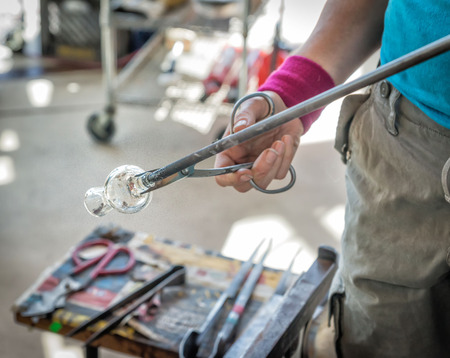 Glass blower working at an open market at Pikes Place Market, Seattle, Washington.のeditorial素材