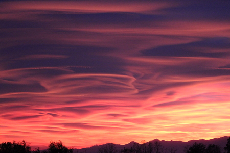 Spectacular sunset in Varese, caused by the smog and the fumes of the firesの写真素材