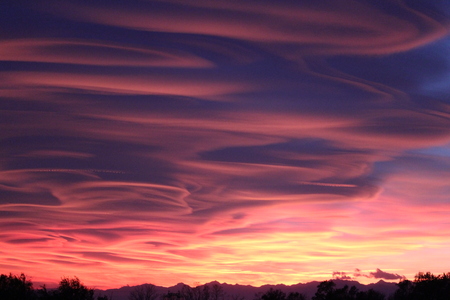 Spectacular sunset in Varese, caused by the smog and the fumes of the firesの写真素材