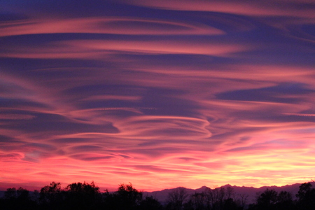 Spectacular sunset in Varese, caused by the smog and the fumes of the firesの写真素材