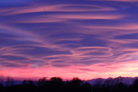 Spectacular sunset in Varese, caused by the smog and the fumes of the firesの写真素材