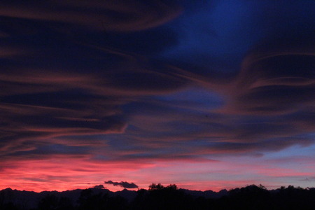 Spectacular sunset in Varese, caused by the smog and the fumes of the firesの写真素材