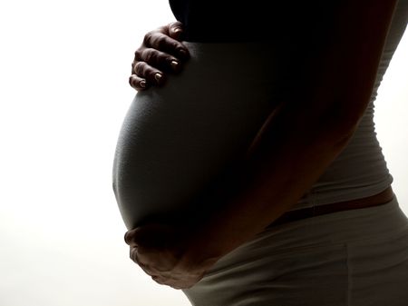 A silhouette of a beautiful pregnant woman