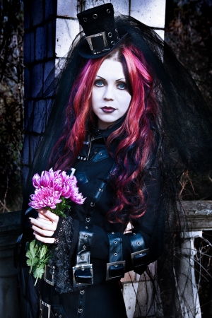 Young goth girl with a red hairの写真素材