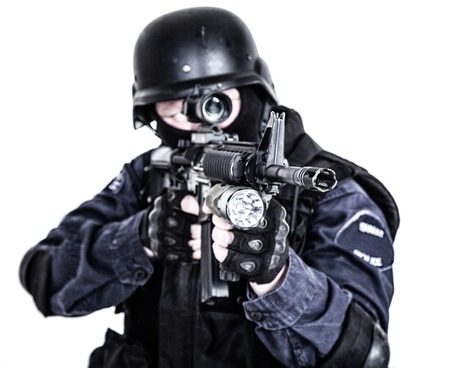Special weapons and tactics SWAT team officer with his gun