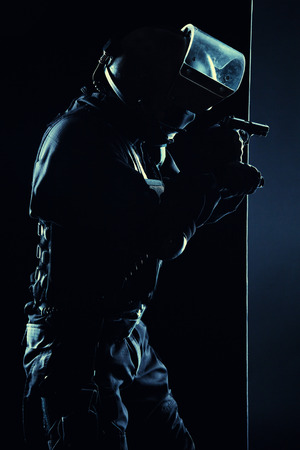 Contour shot of spec ops soldier on black background