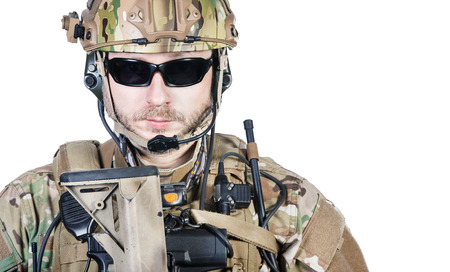 Close up image of bearded special warfare operator in protective helmet