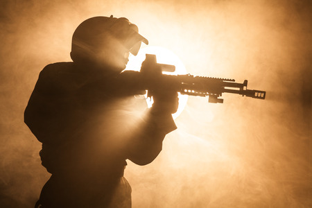 Russian special forces operator in bulletproof helmet in the smoke and fireの写真素材