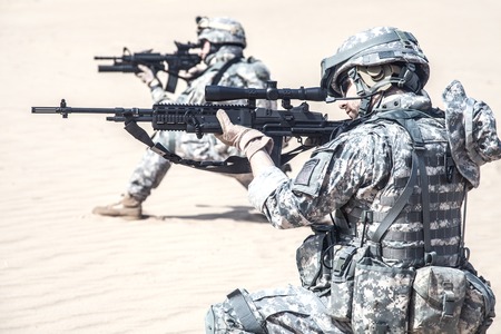United States paratroopers airborne infantrymen in action in the desertの写真素材