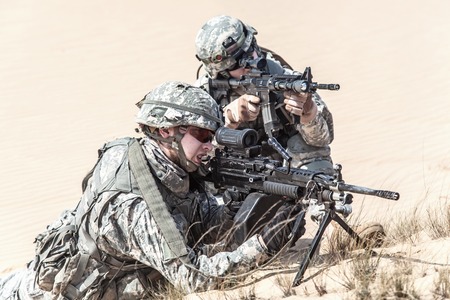 United States paratroopers airborne infantrymen in action in the desert