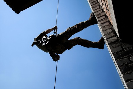 Soldier during assault rappeling exercises with weaponsの写真素材