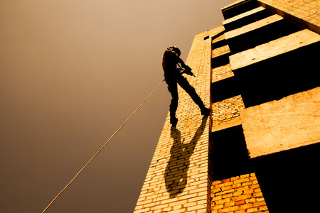 Soldier during assault rappeling exercises with weaponsの写真素材