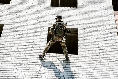 Soldier during assault rappeling exercises with weaponsの写真素材