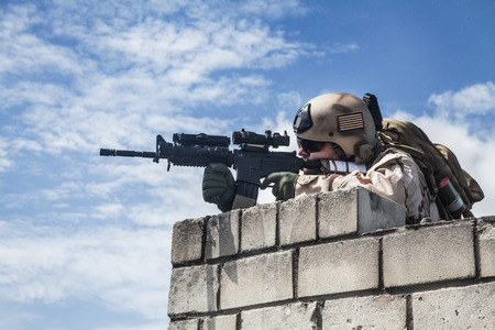 Member of Navy SEAL Team with weapons in actionの写真素材