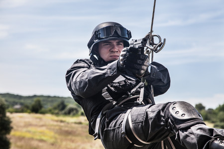 Spec ops police officer SWAT during assault operationの写真素材