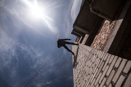 Spec ops police officer SWAT during assault operationの写真素材