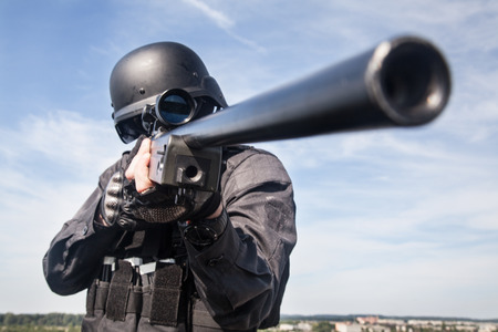 SWAT police sniper in black uniform in actionの写真素材