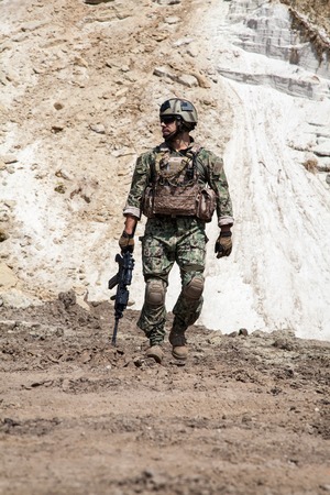 Member of Navy SEAL Team with weapons in actionの写真素材