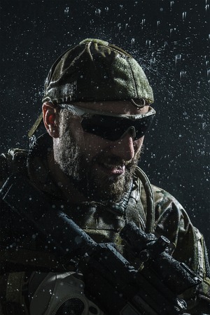Green Berets US Army Special Forces Group soldier in the rainの写真素材