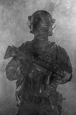 Police officer SWAT in black uniform in the smokeの写真素材