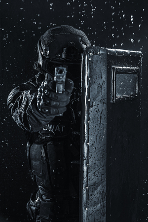 Spec ops police officer SWAT with ballistic shieldの写真素材