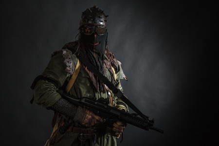 Nuclear post apocalypse. Studio shot of survivor in tattersの写真素材