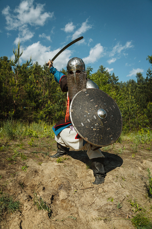 Mongol horde warrior in armour holding traditional saberの写真素材