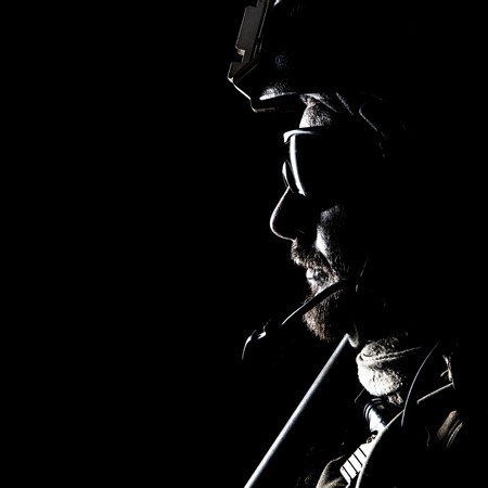 United states Marine Corps special operations command Marsoc raider. Contour backlit studio shot of Marine Special Operator black backgroundの写真素材