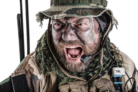 United States Commando face studio shot. Mouth opened, soldier yelling, emitting intiminate formidable frightening scream. Closeup portrait, cropped, isolatedの写真素材