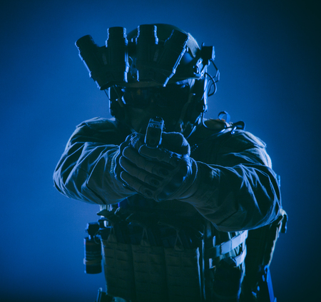 Modern infantry soldier, special forces fighter, police SWAT officer in helmet and body armor,...