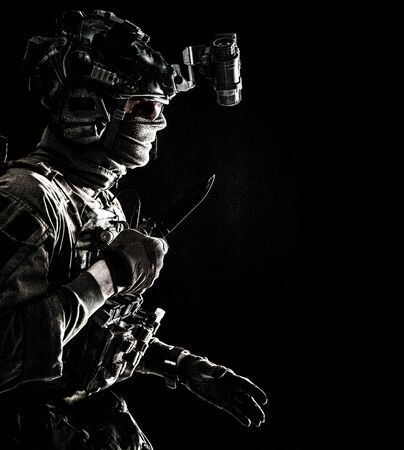 Elite commando soldier sneaking with knife in handの写真素材