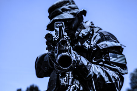Special forces soldier aiming his rifle pointing aiming at objective. High quality colorized photo