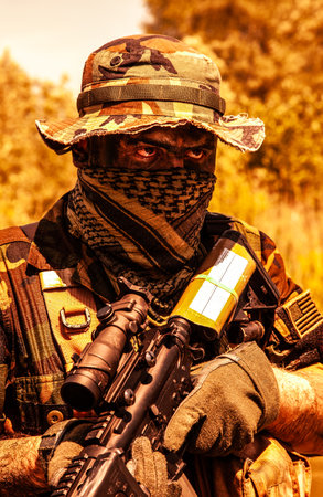 Camouflaged in the foliage, a soldier with piercing eyes holds his rifle, sentinel, harsh military...