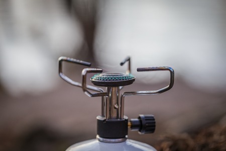 cooking on a gas burner in the woodsの写真素材