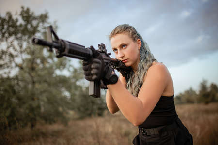 Sexy woman with rifle