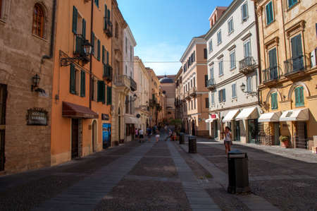 Alghero, Italy - October 03, 2014: Long wide street with tall houses of the port city of Alghero on the island of Sardinia in Italy.のeditorial素材