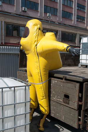 Brno, Czech Republic - May 26, 2012: Yellow suit to protect a person from a dangerous virus or infectionのeditorial素材