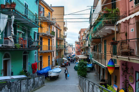 Narrow street with colorful houses in Italy in the Cinque Terre near the sea.